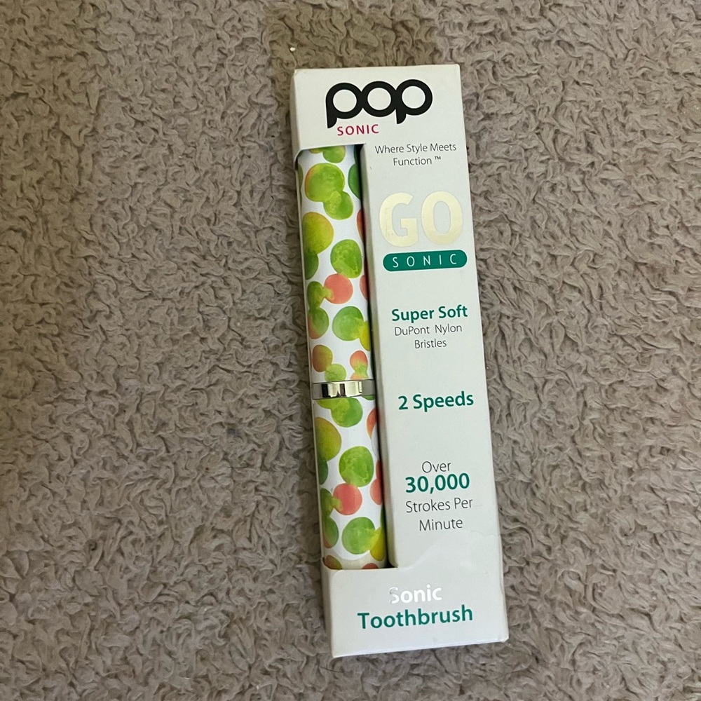 Pop Sonic Go Sonic Toothbrush with Green and Orange Design